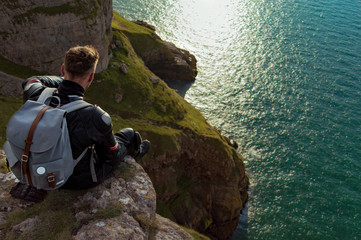 Picture of a biker siting on a cliff in one of national parks in England