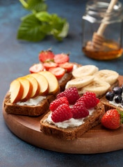Toasts with cream cheese and fresh berries