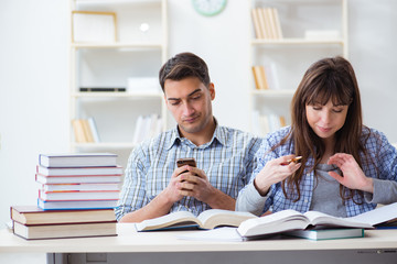 Students sitting and studying in classroom college