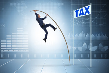 Businessman jumping over tax in tax evasion avoidance concept