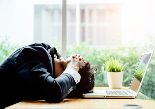 Asian businessman man depressed because he was in trouble in the business he is handle in progress.