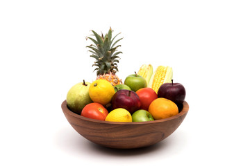 Assort fresh fruits and vegetables in basket isolated on white background