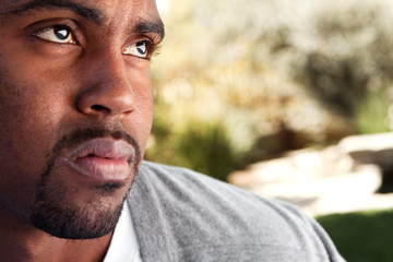 Obraz premium Young African American man looking sad.