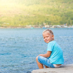 Cute caucasian boy at seaside