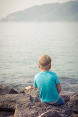 Fototapeta premium Cute caucasian boy at seaside