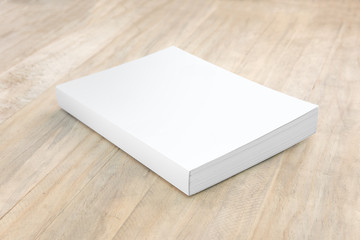 Fototapeta premium Blank hard cover book template on wood.