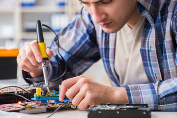 Computer hardware repair and fixing concept by experienced techn