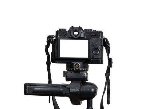 A Professional digital mirrorless camera on tripod on white background, Camera for photographer or Video, Live Streaming equipment concept