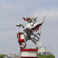 Coat of arms of the City of London, city border marker: single iron dragon holding a shield,...