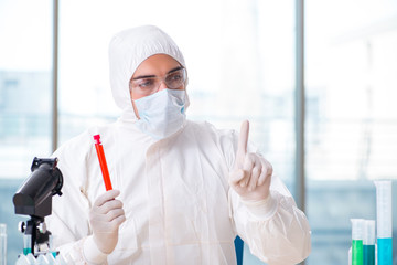 Man doctor checking blood samples in lab