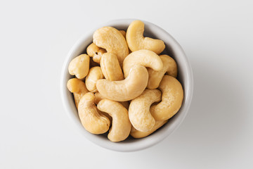 Raw cashew nut in white bowl