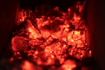 the embers of wood in a stone oven
