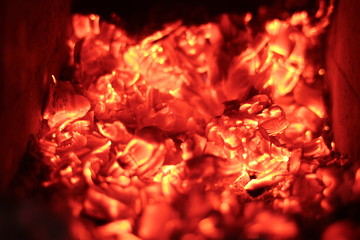 the embers of wood in a stone oven