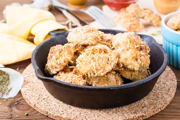 Homemade nuggets from chicken in a iron frying pan