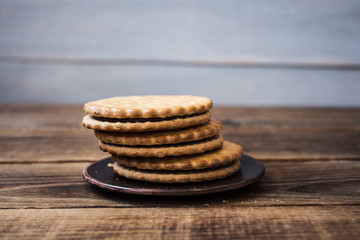 cookies on the plate on wooden background