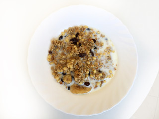 muesli breakfast with oatmeal cereals raisins and milk