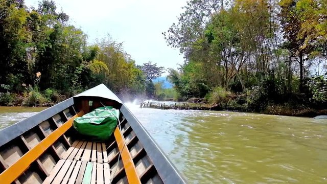 The narrow seasonal creek in Inn Thein (Indein) village with wooden dams and lush forests on the banks is best place for  canoe trip, Inle Lake, Myanmar.