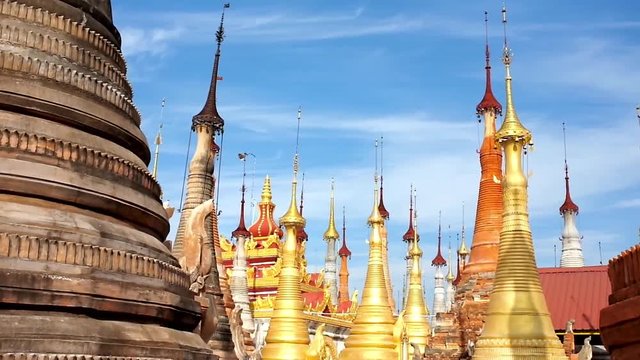 The golden hti umbrellas on the top of medieval stupas of Inn Thein Buddha image Shrine, famous religious and historic site in Indein (Inn Thein) village, Inle Lake, Myanmar.