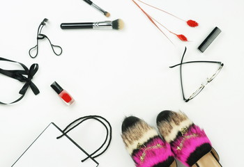 Female fashionable stylish accessories and make up cosmetics. stylish mules shoes , bag,  glasses, lipstick, mascara, powder, brush, on a white background.  Copy space.Flat lay