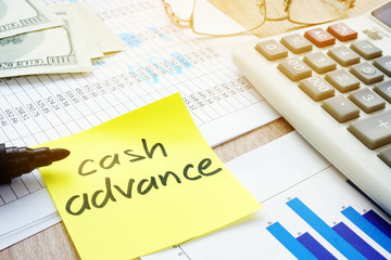 Memo stick about cash advance and calculator.