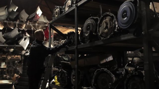 auto mechanic in the auto parts warehouse