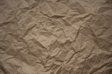Brown rough crumpled recycled paper texture