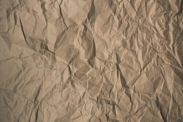 Brown rough crumpled recycled paper texture