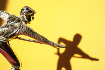 billiards. billiard player on a yellow background