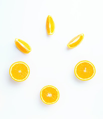 Top view of slices and whole of orange fruits on light background. Composition of oranges.