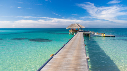 Fototapeta premium Tropical pier and wooden pathway on summer beach scene