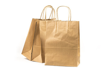 Various kraft paper bags isolated on white background