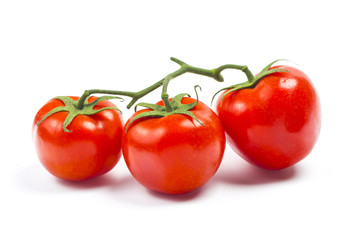 Top view of bunch of fresh tomatoes isolated on white background