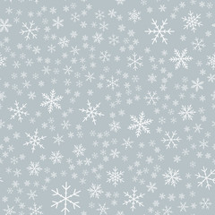 White snowflakes seamless pattern on light grey Christmas background. Chaotic scattered white snowflakes. Fascinating Christmas creative pattern. Vector illustration.