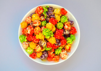 Bowl of colored popcorn. Top view.
