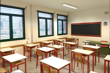 interior of a roomPicture of an elementary / secondary of first grade school with tables and chairs arranged in a check board pattern
