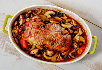 roast pork with mushrooms and tomatoes