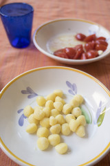 potato small dumplings with fresh tomatoes