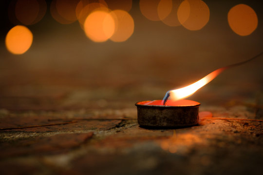 Prayer and hope concept.Retro candle light and retro road .