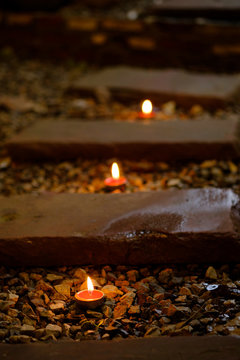 Prayer and hope concept.Retro candle light and retro road .