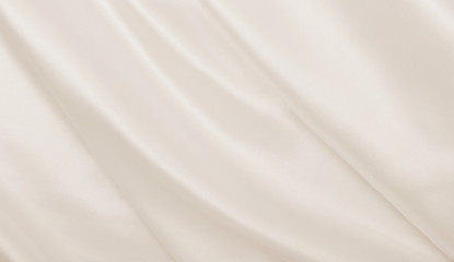 Smooth elegant golden silk or satin luxury cloth texture as wedding background. Luxurious Christmas...