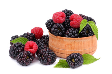 blackberries with raspberries in wooden bowl isolated on white background