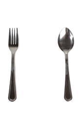 Metal spoons and forks on a white background