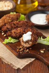 Traditional arabic kibbeh with lamb and pine nuts.