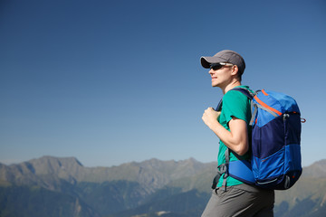 Image of tourist man in sunglasses with backpack