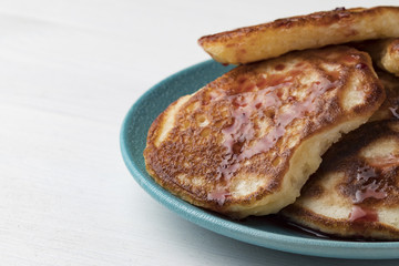 pancakes with cherry jam on a plate