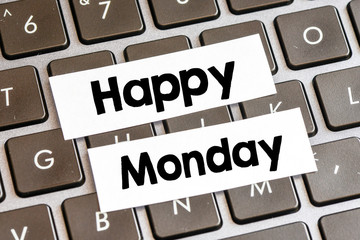 Closeup of laptop keyboard buttons with symbols and text Happy Monday