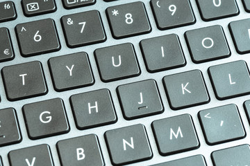 Closeup of laptop keyboard buttons with symbols 