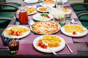 pizza, compote, salad and potatoes for lunch for children