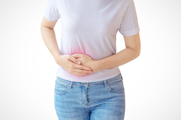 Woman stomachache on white wall background.