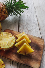 pineapple on the wood texture background
